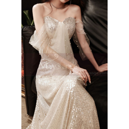 Gold sequin evening dress with bustier and pretty openwork veil sleeves