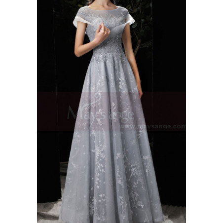 Very chic evening dress in soft tulle with embroidered top and charming lacing on the stylish back