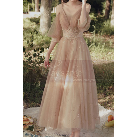 Nude long dress for ceremony in glittery tulle with pretty embroidery on the tail and slit sleeves